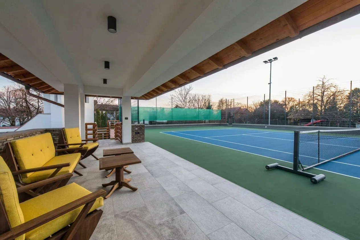 The finished result of professional tennis court resurfacing: the completed work looking clean, — Peoria, IL